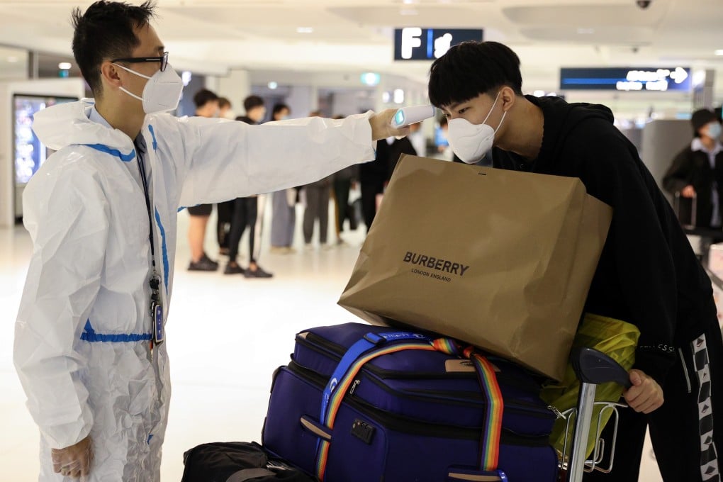 Sunny Gu, an international student from China, arrives at Sydney International Airport. Photo: Reuters