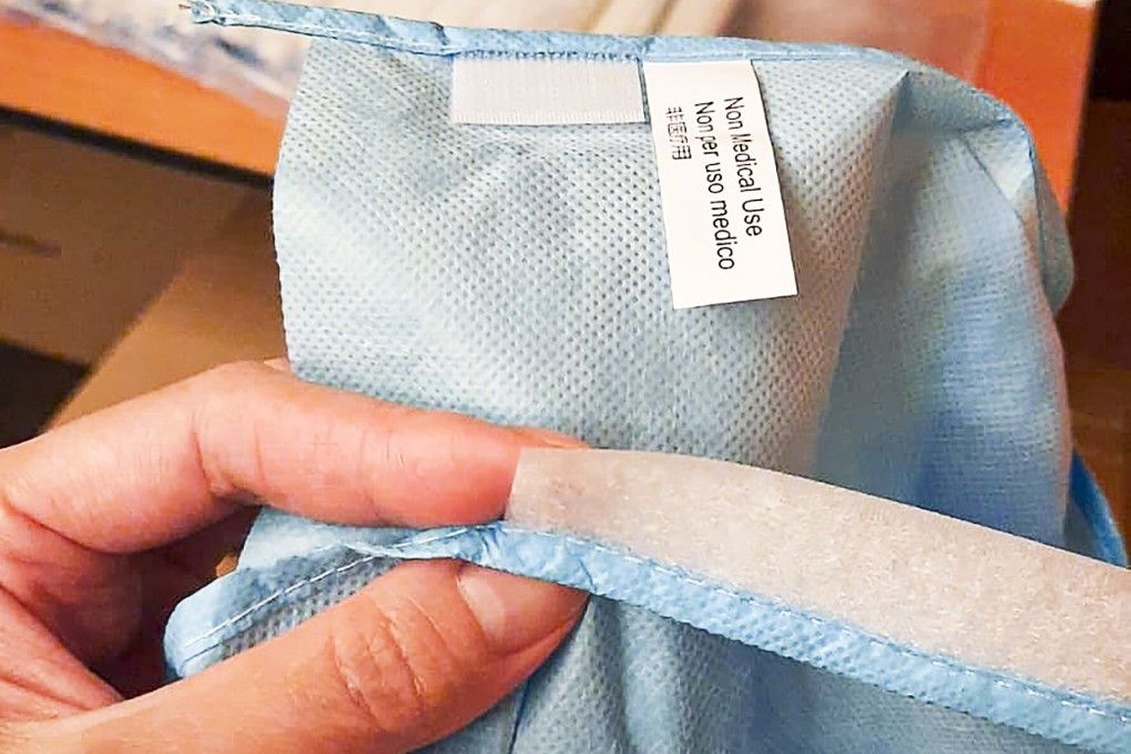 Gowns being used at the Covid-19 collection point at the Hong Kong Convention and Exhibition Centre have a label reading not for medical use. Photo: Handout