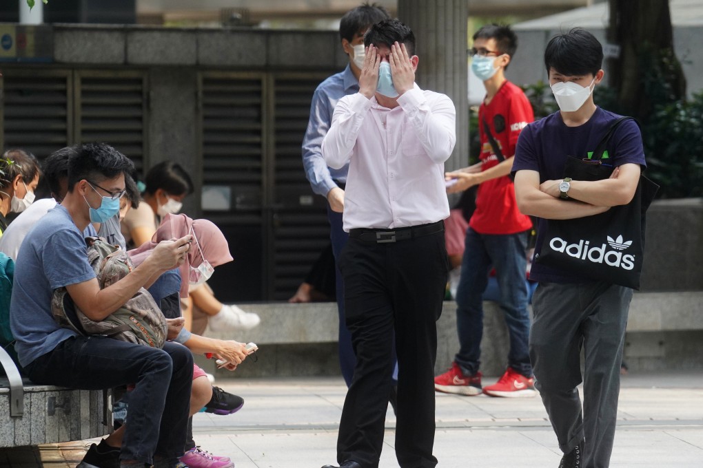 Lee Man-him, one of three pleading guilty on Friday to rioting, tries to cover his face as he arrives at court. Photo: Winson Wong