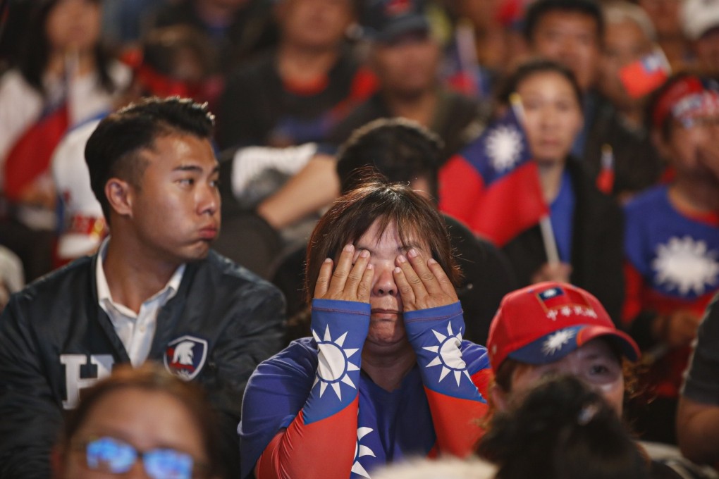 Dejected supporters of Kuomintang presidential candidate Han Kuo-yu follow the online counting of ballots in Kaohsiung on January 11. The party was defeated in the last two presidential elections, before the Kaohsiung mayoral setback in August. Photo: EPA-EFE