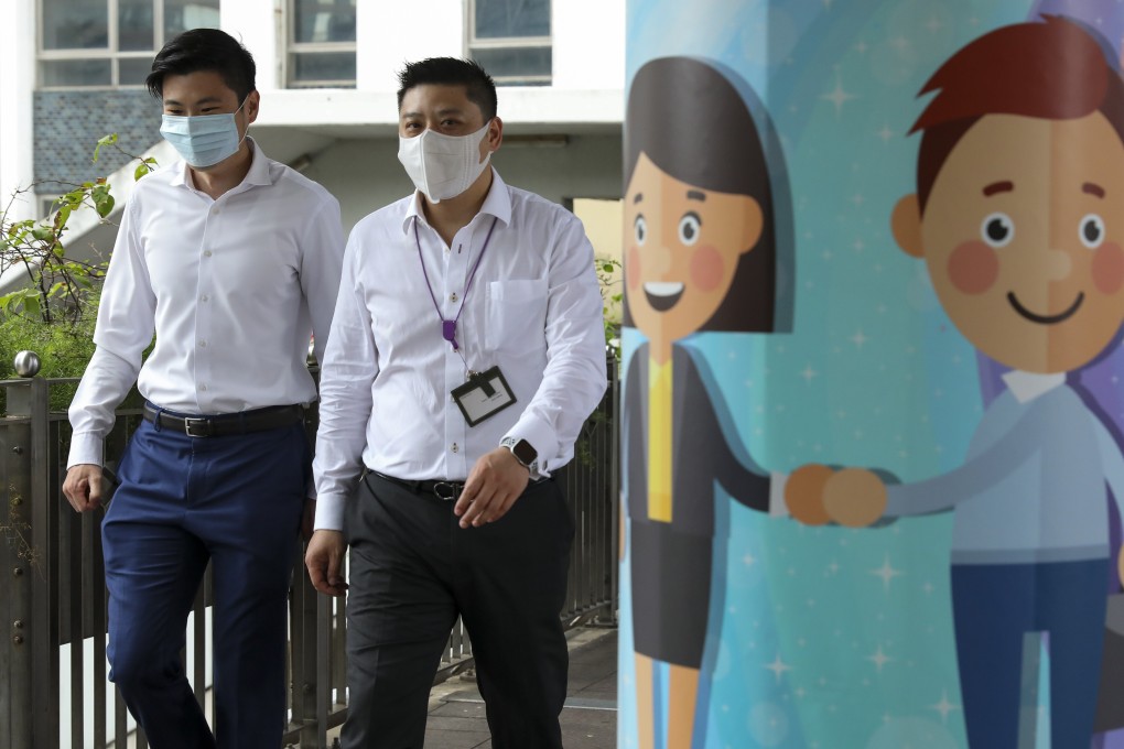 Pedestrians walk past a mural in the Central district of Hong Kong during a coronavirus disease outbreak in the city, on July 20. Photo: handout