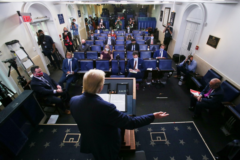 US President Donald Trump gestures as he answers reporters questions during a news conference at the White House on Friday. Photo: Reuters