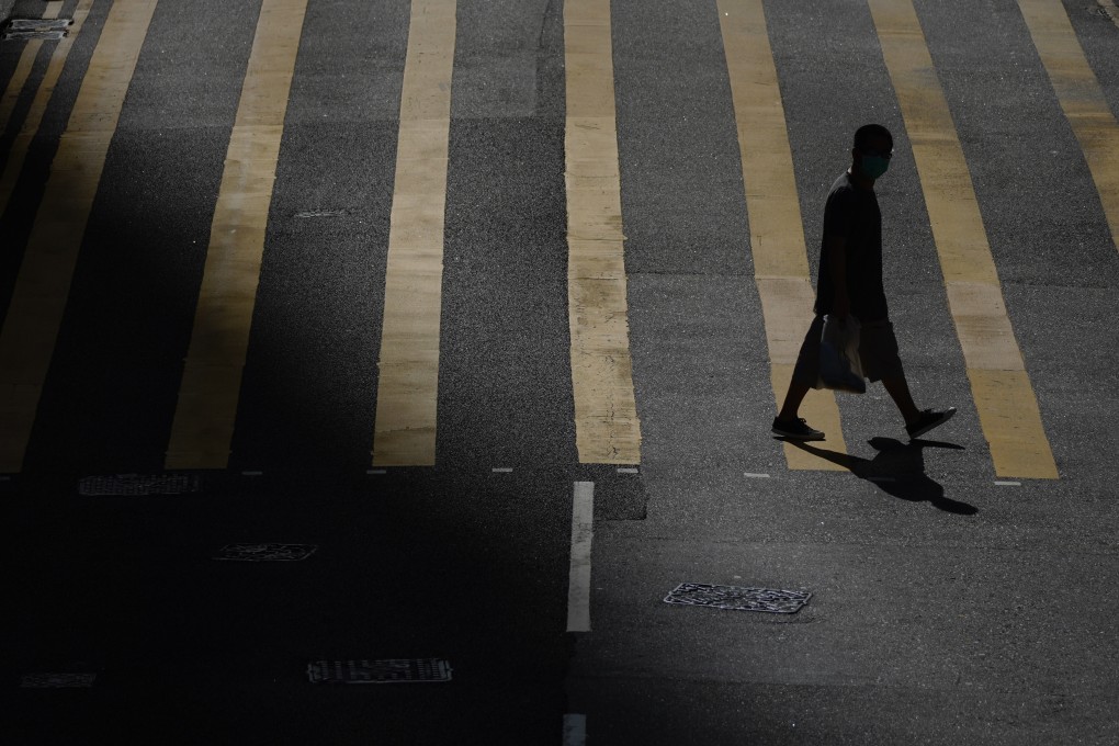 A person crosses the road in Tsz Wan Shan, Wong Tai Sin. Photo: Sam Tsang