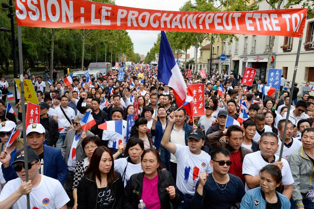 Chinese community groups protest in Paris to demand better protection after the death of Zhang Chaolin in 2016. Photo: AFP