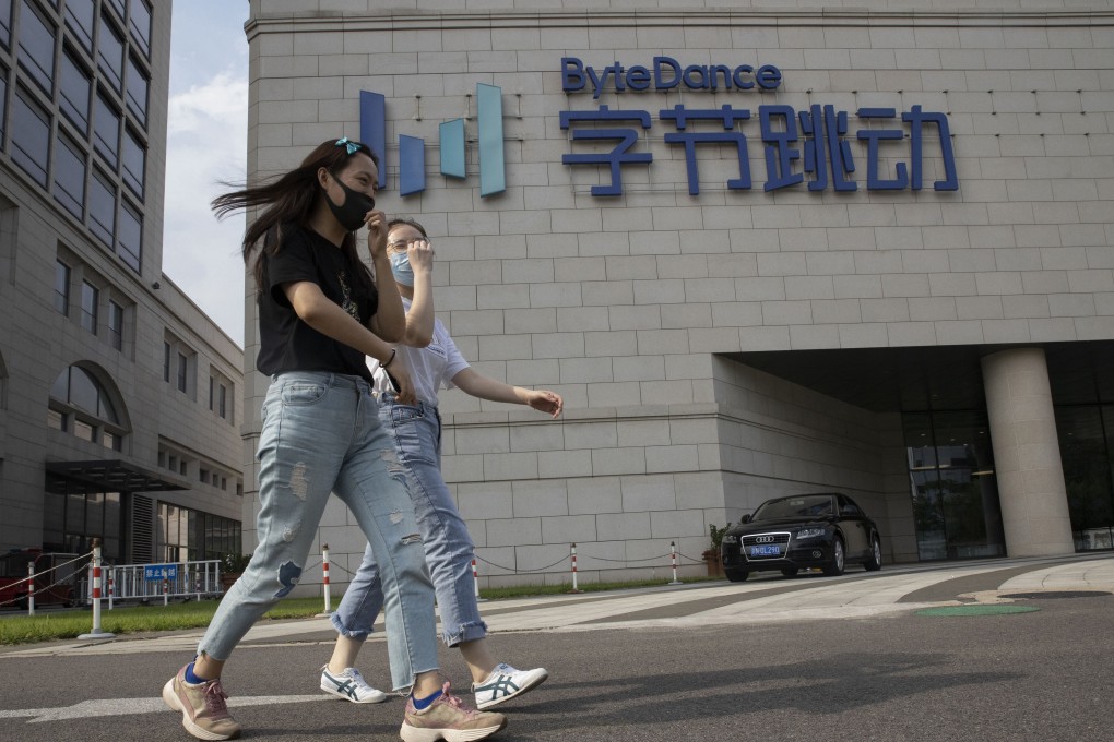 Two women walk near the Beijing headquarters of ByteDance on August 7. China’s revised tech export controls have complicated negotiations for TikTok owner ByteDance to divest the US operation of its popular short video-sharing service. Photo: AP
