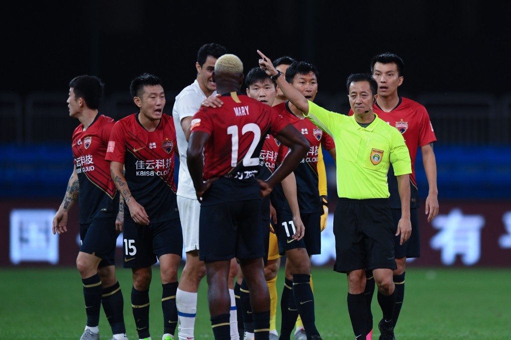 John Mary of Shenzhen FC is sent off during the match against Shanghai Shenhua. Photo: Xinhua