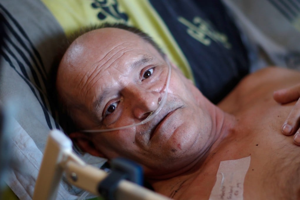 Alain Cocq, 57, in his medical bed he has been confined to for years as a result of a degenerative disease that has no treatment. Photo: Reuters