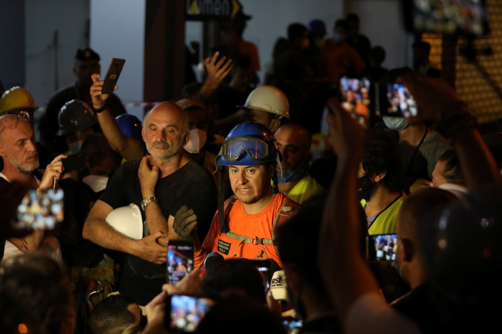 Francisco Lermanda, a member of the Chilean team talks during a press conference after digging through the rubble. Photo: Reuters