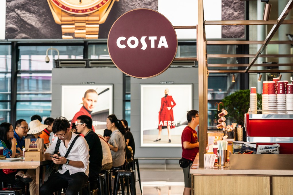 Customers seen at a Costa Coffee store in Shanghai Hongqiao International Airport. Photo: Alex Tai/SOPA Images