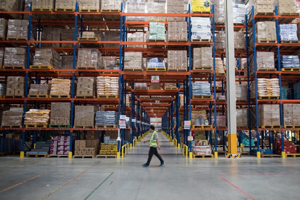 Workers in a TMall.com warehouse in Jiangmen, Guangdong Province. Photo: EPA-EFE