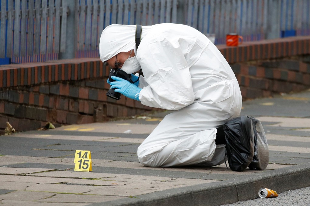 A forensic worker investigates at the scene of reported stabbings in Birmingham. Photo: Reuters