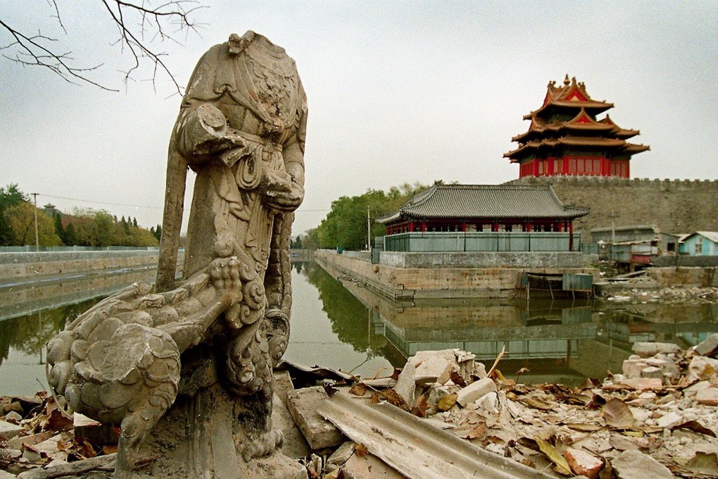 Old structures, including statues like this one in 1998, were torn down near Beijing’s Forbidden City as money and power joined hands in property development. Photo: Mark Ralston