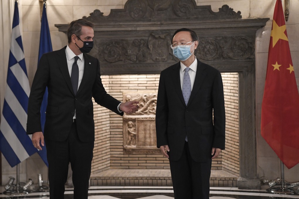 Greek Prime Minister Kyriakos Mitsotakis welcomes Yang Jiechi to Athens. Photo: EPA-EFE