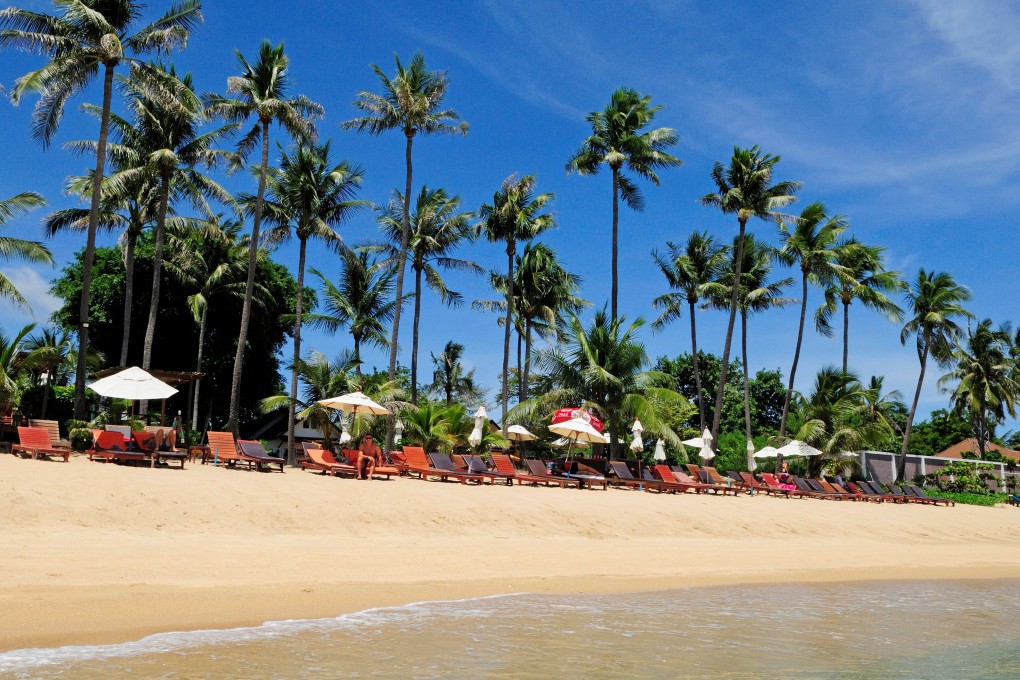 Holidaymakers sunbathe on Maenam Beach in Koh Samui. A study by British company Parkdean Resorts comparing the sand colour of British beaches to ones around the world matched this beach to West Wittering Beach in the English county of West Sussex. Photo: Universal Images Group via Getty Images