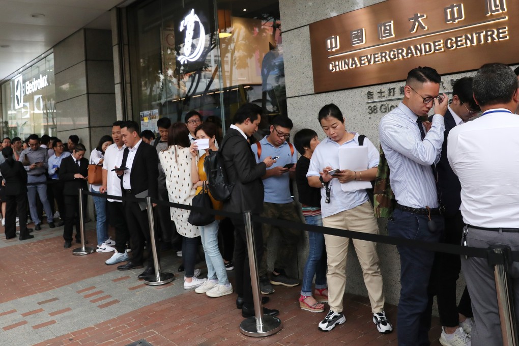 Potential buyers queue for Evergrande Group’s Emerald Bay project in Tuen Mun at the developer’s Wan Chai sales office on October 28, 2019. Photo: May Tse