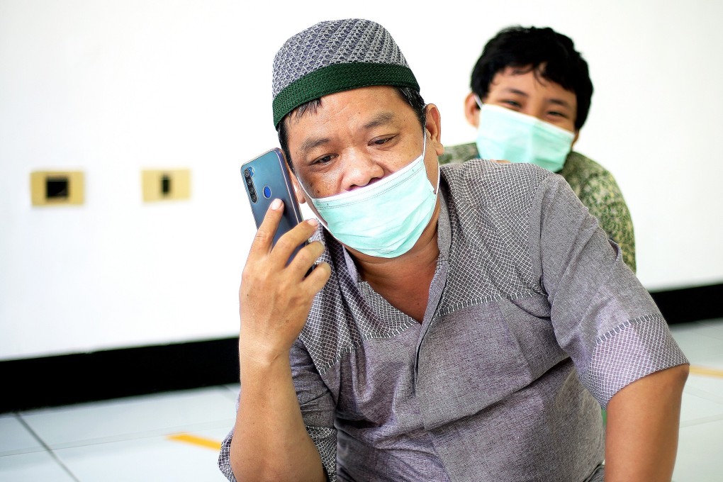 Blue-collar worker Bambang Hermanto (left), who has a 10-year-old son (right), has struggled to make ends meet due to social distancing restrictions in Jakarta. Photo: Witness News/Nur Ahmad Fatoni