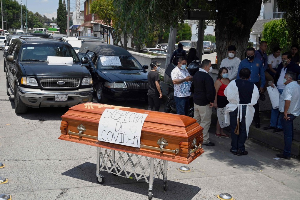 A group of Mexican funeral workers demonstrate to demand more medical death certificates to speed the procedures for Covid-19 deaths. Photo: AFP