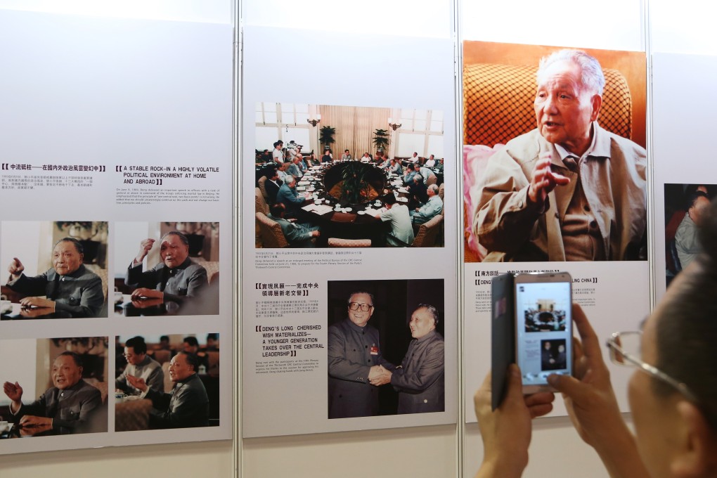 A visitor takes a picture during the opening ceremony of an exhibition dedicated to Deng Xiaoping, at the Hong Kong Convention and Exhibition Centre in Wan Chai on August 21, 2014. Photo: Sam Tsang