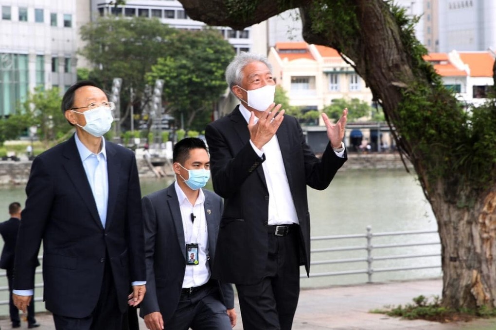 China’s top diplomat Yang Jiechi (left) takes a stroll along the Singapore River with Singaporean senior minister Teo Chee Hean last month. Photo: Facebook