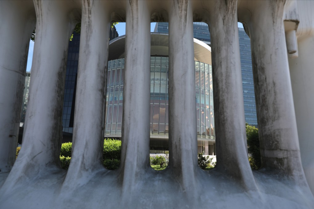 The Legislative Council complex in Tamar, Admiralty, as seen through water barriers surrounding the building, on July 28. Photo: Nora Tam
