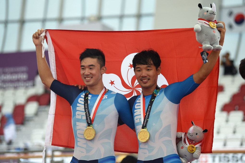 Leung Chun-wing (left) and Cheung King-lok celebrate after capturing a men's madison gold medal for Hong Kong at the 2018 Asian Games in Jakarta. Photo: AFP