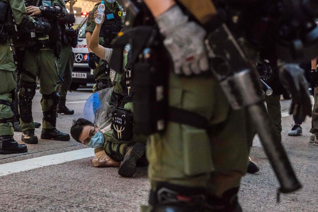 Police detain a man after protesters called for a rally in Hong Kong on September 6, 2020, to protest against the government's decision to postpone the legislative council election. Photo: AFP