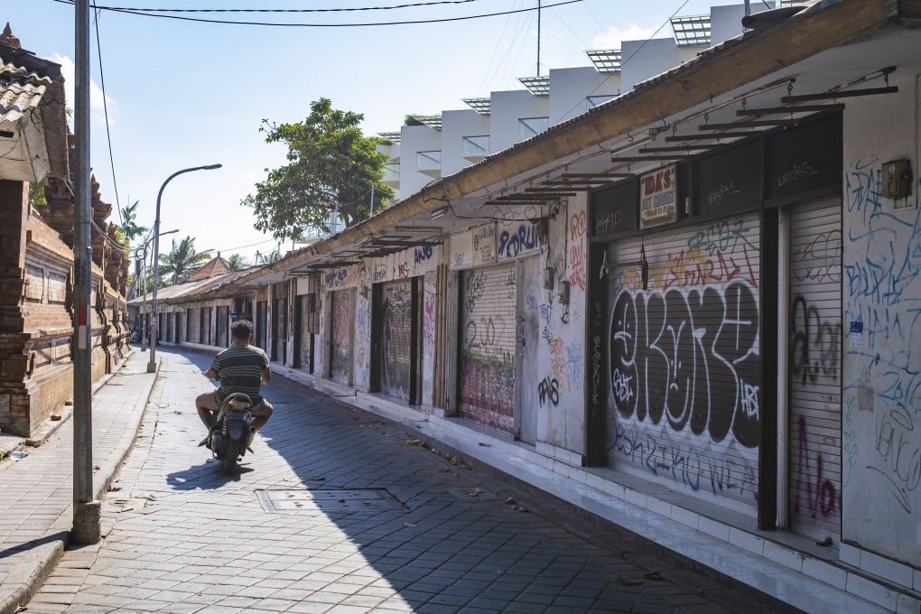 Shuttered souvenir shops in Kuta, Bali, in August. The island will remain closed to international tourists until next year. Photo: EPA-EFE