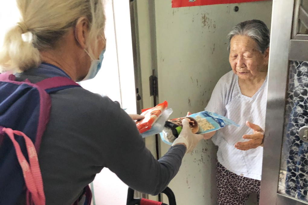 A HandsOn Hong Kong volunteer delivers relief packages to the city’s needy. Photo: HandsOn Hong Kong