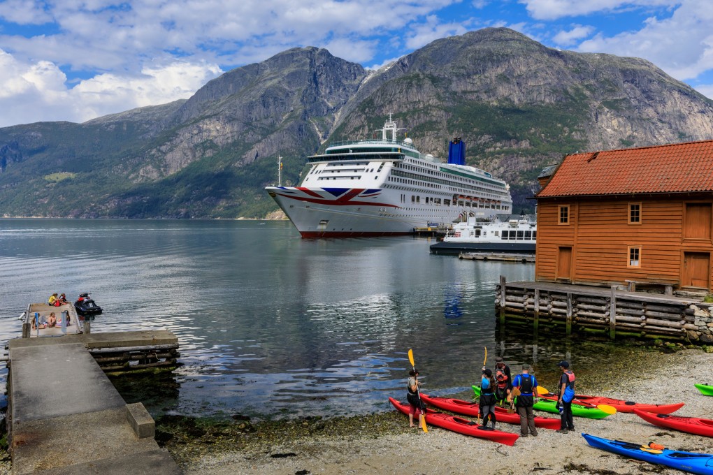 Tourists get ready to kayak on the shore of a fiord in Hordaland, Norway. After months of inactivity, adventurous holidaymakers will be eager to get the adrenaline pumping on trips like this. Photo: Shutterstock
