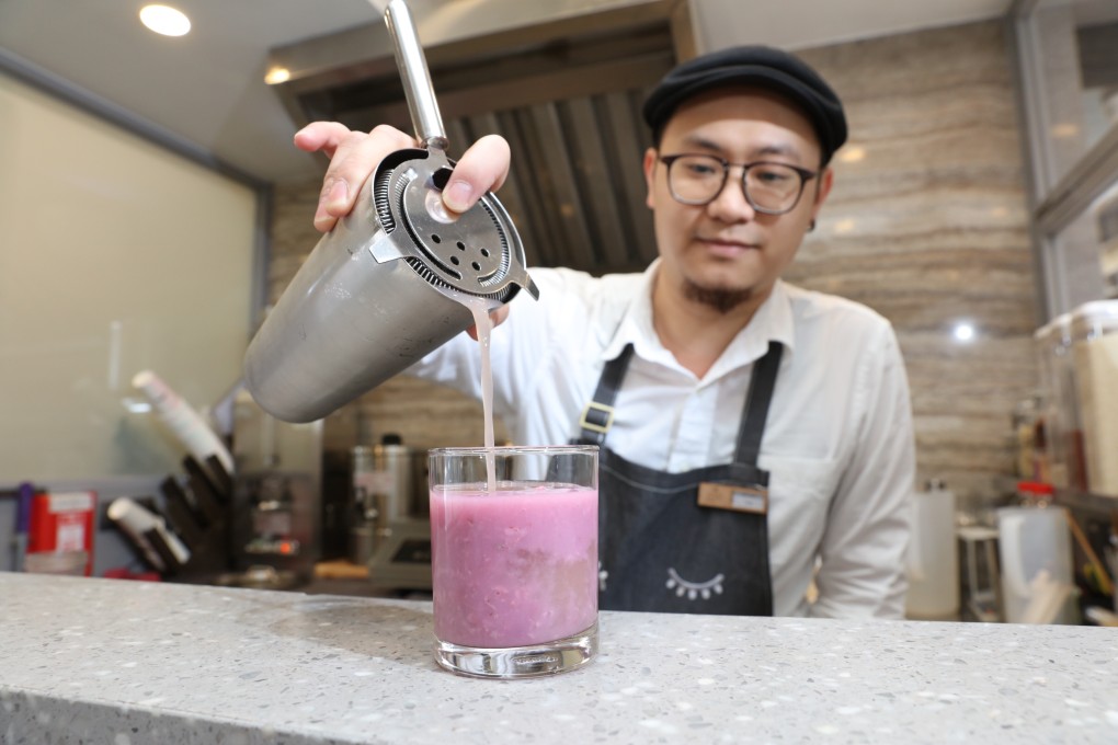 A mixologist prepares a mocktail of purple sweet potato and oats rice water in the Sheung Wan store of CheckCheckCin, which is promoting a modern approach to traditional Chinese medicine among Hong Kong’s younger consumers. Photo: Felix Wong