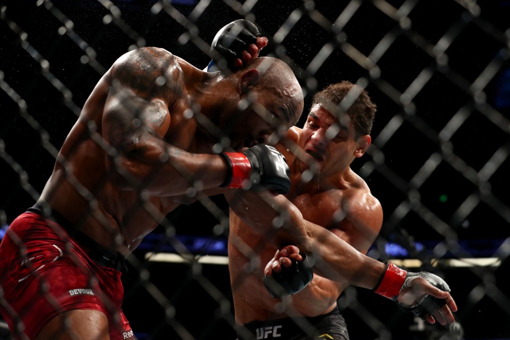 Paulo Costa throws a punch in the second round against Yoel Romero during their middleweight Bout at UFC 241 in August. Photo: AFP