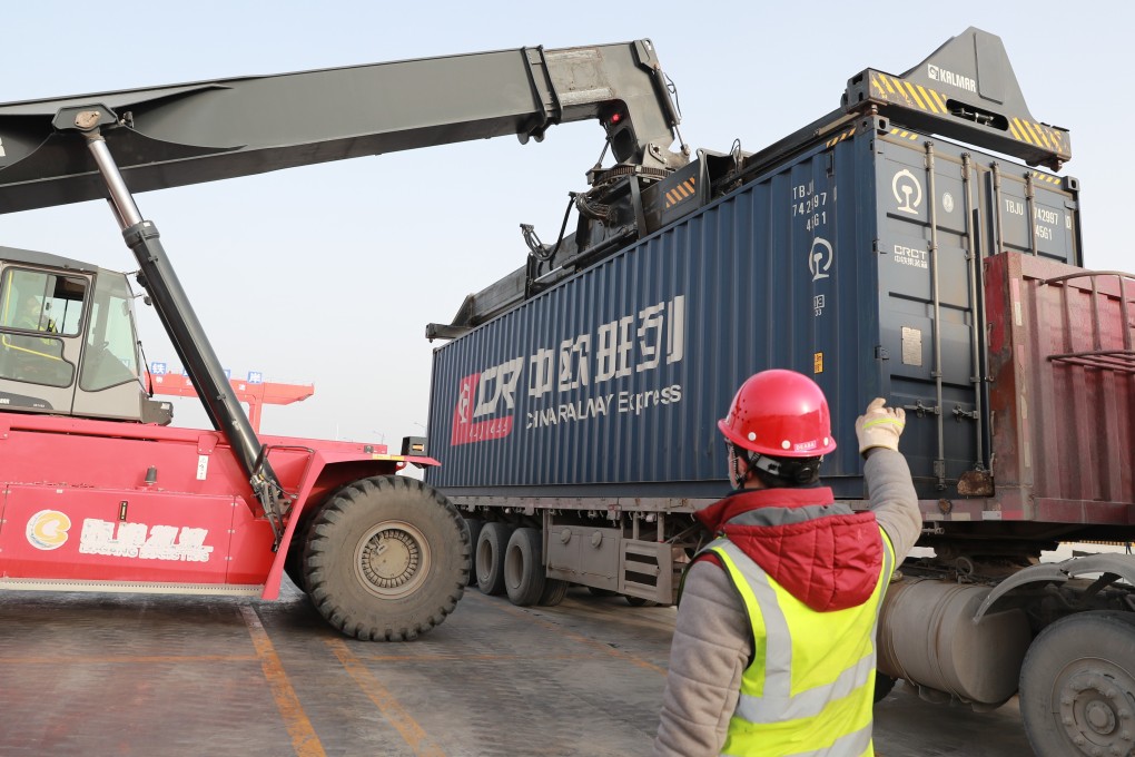 Workers unload imported goods from one of the China-Europe freight trains at a logistics park of the Lanzhou New Area in China’s Gansu province. Photo: Xinhua