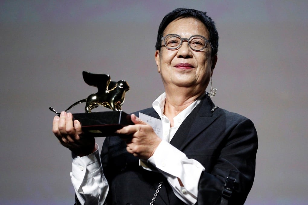 The 77th Venice Film Festival – Golden Lion for Lifetime Achievement Award ceremony – Venice, Italy, September 8, 2020 – Director Ann Hui holds the Golden Lion award for lifetime achievement. REUTERS/Guglielmo Mangiapane