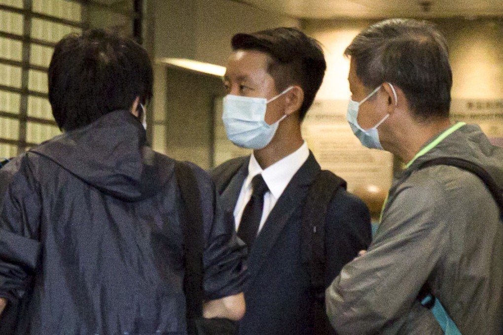 Wong Chi-yan (centre) outside Eastern Court on Wednesday. Photo: Brian Wong