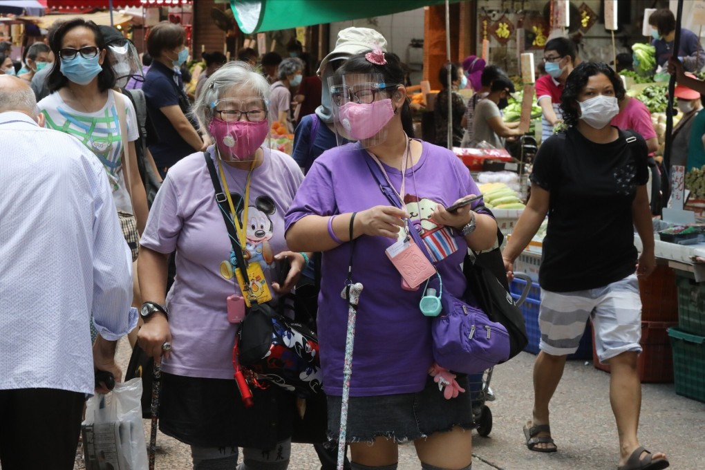People wear masks while shopping at a market in Mong Kok in August. Photo: K.Y. Cheng