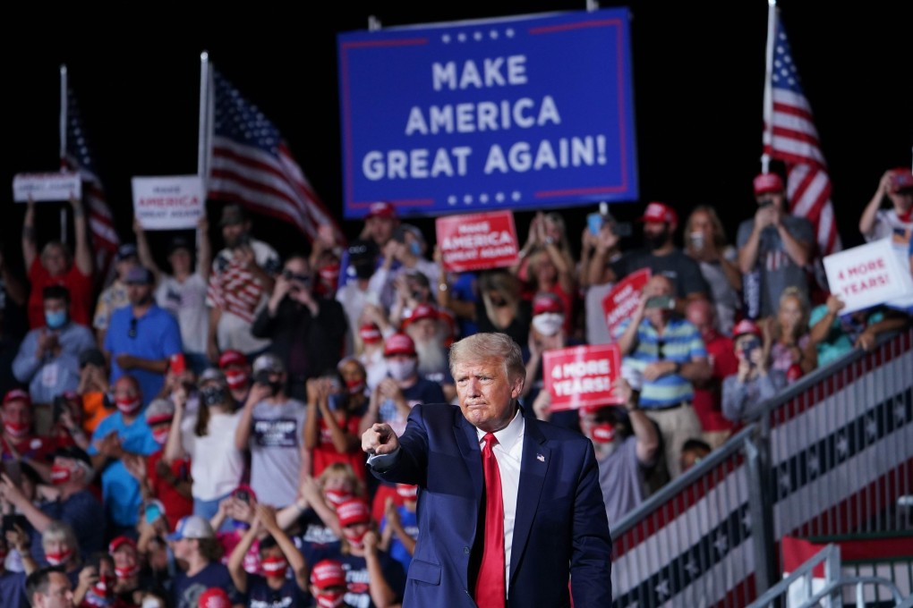 US President Donald Trump gestures at supporters during a campaign rally in North Carolina on Tuesday. Photo: AFP