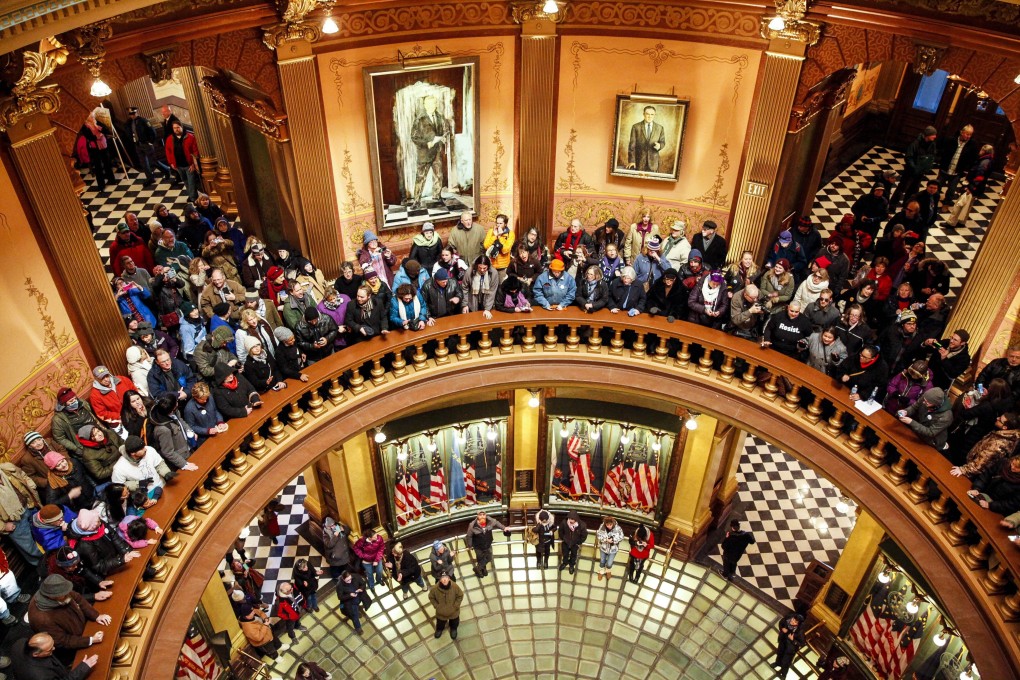 Protesters gather at the Michigan State Capitol before the state’s Electoral College electors meet to cast their votes for Donald Trump on December 19, 2016. Photo: AFP