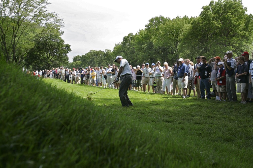 Tiger Woods hits from the rough on the fifth hole during a practice round for the US Open golf tournament at Winged Foot Golf Club. Woods returns to Winged Foot for the US Open next week. It's the site of his first missed cut in a major. Photo: AP