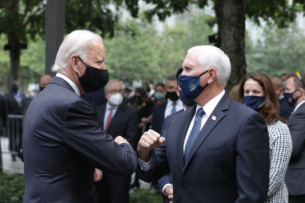 Democratic presidential candidate Joe Biden (left) greets US Vice-President Mike Pence at a ceremony to mark the 19th anniversary of the 9/11 attacks in New York. Photo: AFP
