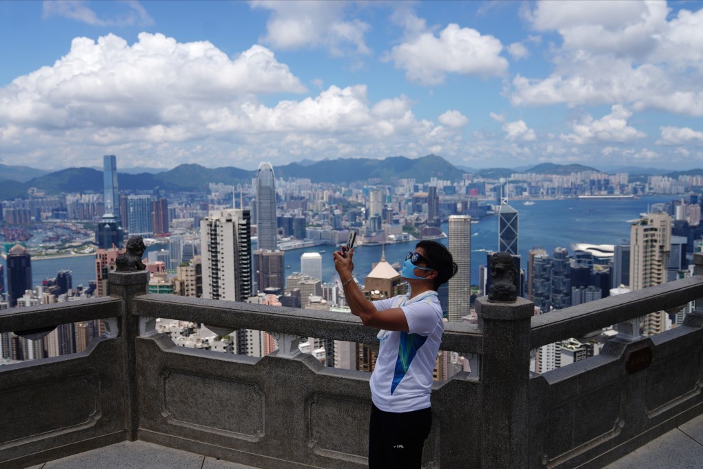 A person takes a selfie on The Peak on August 14. The damage inflicted by the pandemic and global lockdowns to the tourism sector is already breathtaking. Photo: Sam Tsang