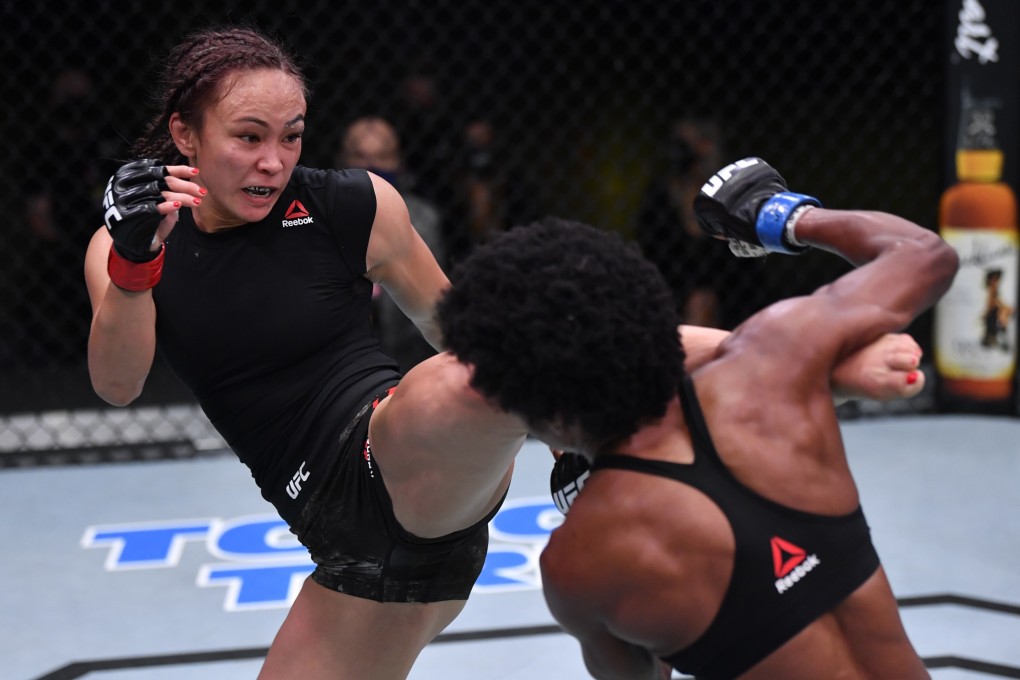 Michelle Waterson kicks Angela Hill in their strawweight fight during the UFC Fight Night event in Las Vegas. Photo: Jeff Bottari/Zuffa LLC