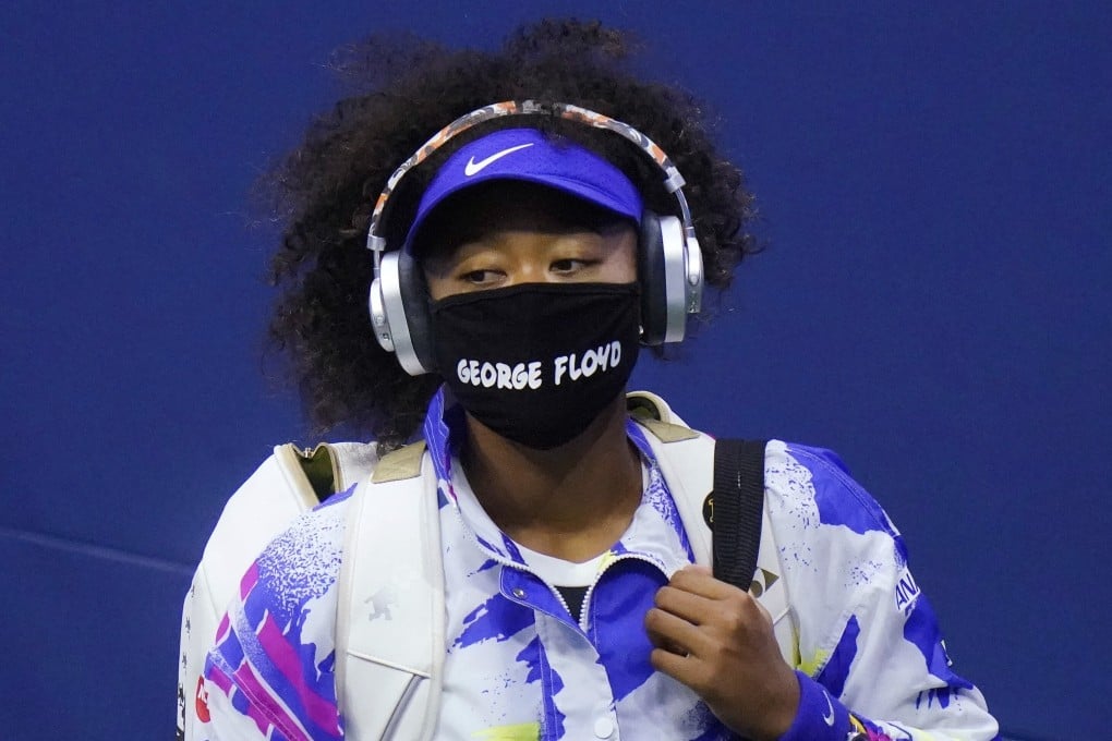 Naomi Osaka wears a protective mask due to the Covid-19 virus outbreak, featuring the name “George Floyd” at the 2020 US Open. Osaka wore masks bearing a different name of a victim of police or racist violence for every game. Photo: AP