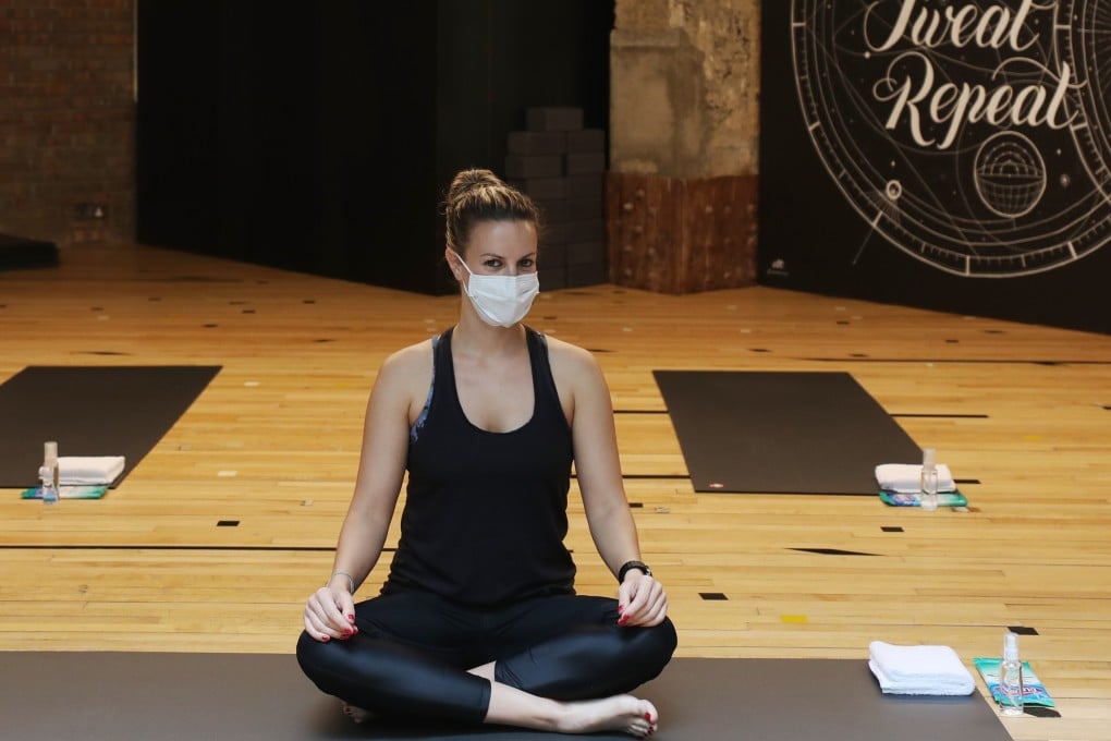 Sasha Kolarov, the co-founder of Flowga in Lan Kwai Fong, said she cannot allow her clients to do hot yoga while wearing a mask. Photo: Xiaomei Chen