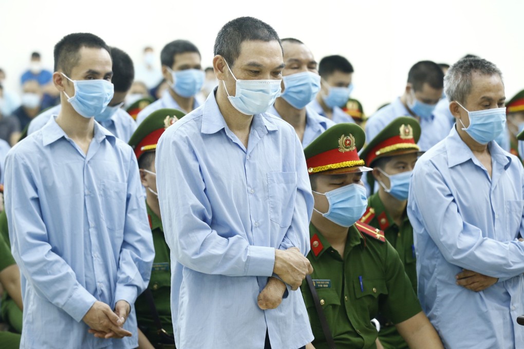 Farmers of Dong Tam village during their trial. Photo: Reuters