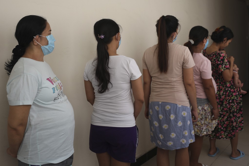 Former domestic helpers from the Philippines and Indonesia in a safe house on Hong Kong Island for new and expectant mothers. Photo: Xiaomei Chen