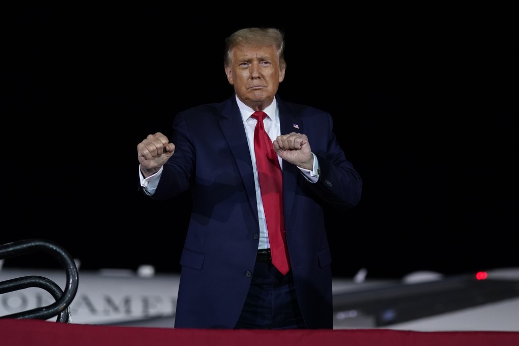 US President Donald Trump gestures during a campaign rally at MBS International Airport in Michigan on September 10. Photo: AP
