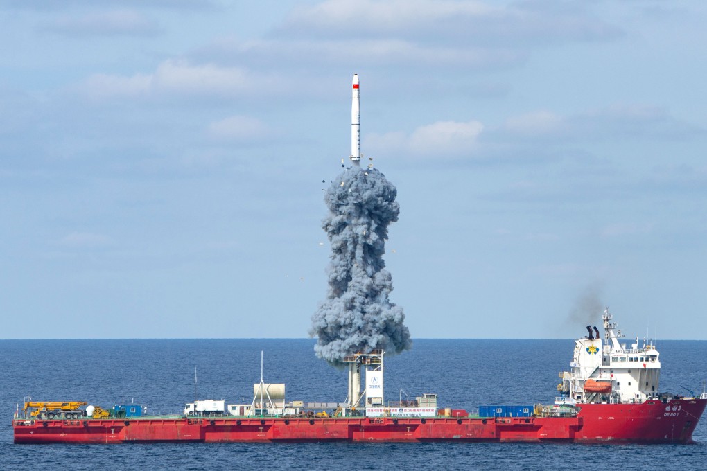 A Long March-11 rocket carrying nine satellites for the Jilin-1 remote sensing constellation lifts off on Tuesday morning. Photo: Xinhua