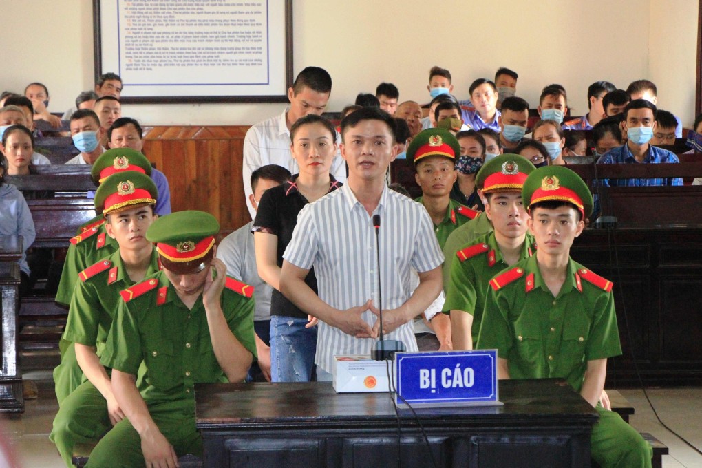 Defendants are seen during a trial in Ha Tinh province against those involved in the deaths of 39 migrants found in a refrigerated truck in Britain last year. Photo: AFP