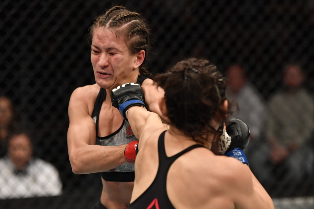 China’s Yan Xiaonan punches Poland’s Karolina Kowalkiewicz in their strawweight bout at February’s UFC Fight Night in Auckland. Photo: Photo by Jeff Bottari/Zuffa LLC