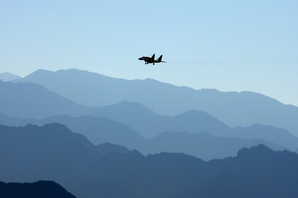 An Indian Air Force fighter jet flies over a mountain range in Leh, the joint capital of the union territory of Ladakh, which borders China. Photo: AFP